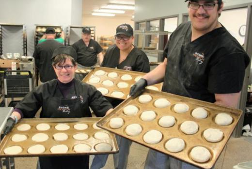 Building Futures employees with baked goods